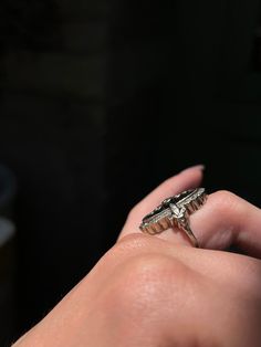 During the Victorian era, navette or “little ship” rings were highly en vogue, and were the perfect statement pieces for elegant nights out or celebrations. This rare Art Deco ring emulates the understated glamor of the navette design, creating a gorgeous and memorable silhouette! Crafted circa 1920’s in 18 carat white gold, this ring features a truly unique synthetic blue topaz gem with a smooth, flat cut. Just look at that hue! The dimensions of color in this topaz is remarkable, and there is Classic Diamond White Rings For Evening, Evening Rings With Brilliant Cut, Timeless Diamond Cut Evening Rings, Timeless Diamond Cut Rings For Evening, Timeless Oval Jewelry For Evening, Classic Silver Diamond Ring For Evening, Marquise Diamond Jewelry For Evening, Classic Platinum Rings For Evening, Brilliant Cut Diamond Rings For Evening