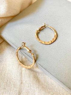 Handmade in S.Korea Detailed & Delicate/Modern Design This Product is : - 30mm Diameter - 18k Gold Plated Brass - Sold as a pair We carefully select each Aeolus products to be quality guaranteed and fashionable. Please feel free to contact us if you have any questions. Modern Gold Hammered Hoop Earrings, Yellow Gold Hammered Metal Hoop Earrings, Gold Hammered Round Huggie Earrings, Hammered Gold Round Huggie Earrings, Hammered Metal Hoop Earrings, Gold Small Hoop Hammered Earrings, Hammered Gold-plated Hoop Earrings, Hammered Gold-plated Small Hoop Earrings, Small Hammered Gold-plated Hoop Earrings