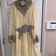 Light Yellow Kaftan Dress With Crystals And Stones. Used Condition Has A Few Stains That Will Go Away With Dry Clean. Very Beautiful Heavy Hand Beaded Dress Kaftan Dress, Light Yellow, Beaded Dress, Hand Beading, Colorful Dresses, Long Sleeve Dress, Yellow, Womens Dresses, Long Sleeve