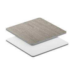 two white and grey square coasters with wood grain design on the top, one in gray