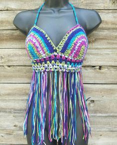 This super comfortable crochet bikini top is perfect for lounging at your favorite summer festival. It is made with 100% acrylic yarn in varying rainbow colors of lime green, pink, dark purple, and blue. Laces up the back and ties around the neck. Custom made to fit your size and measurements. Want padding added? Add this listing to your order and choose from either push up or regular foam padding. https://www.etsy.com/listing/399021473/add-padding-to-your-crochet-top Multicolor Triangle Halter Top For Festival, Multicolor Summer Halter Top For Festival, Multicolor Festival Halter Top For Summer, Festival Crochet Stretch Swimwear, Bohemian Multicolor Halter Top For Festival, Fitted Rave Tops For Beach, Fitted Rave Tops For The Beach, Purple Crochet Beach Top, Purple Crochet Top For Beach