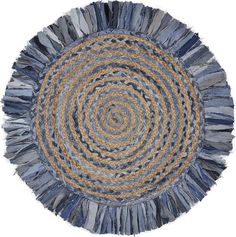 a round rug made out of blue and yellow fabric with fringes on the bottom