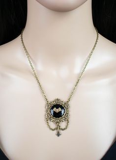 "This brass filigree and black glass necklace will add a touch of Victorian Gothic charm to your outfit. It would make a fabulous gift for any bat lover. 💀 DESCRIPTION: This elegant Y necklace features a small bat stamping that was hand set onto a vintage jet black cabochon. It was set into a lace edge setting and then layered onto an ornate filigree with Fleur de Lis detailing. The filigree is adorned with chain and an Art Deco style drop. The cable chain was finished with a lobster clasp and Bat Pendant, Flying Bat, Skull Purse, Crow Skull, Brass Filigree, Victorian Goth, Y Necklace, Metal Girl, Pet Necklace