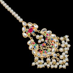 An exquisite set that draws attention with its echoes of traditional motifs. Alluringly timeless set enhanced with nauratan stones. Approximate mala length is 15". The set includes a choker paired with a mala, a matching maang teekah and a jhoomar and a pair of matching earrings. Approximate earrings length is 4.5". Gold-plated on high-quality brass as base metal. Made by order. Kindly allow 4-6 weeks for the delivery of this item. For custom or urgent requests, please contact support@alacouture Traditional Motifs, Base Metal, Matching Earrings, Choker, Statement Necklace, Gold Plate, Plating, Brass, Stone