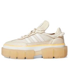 Get a fashion-forward look with the Ivy Park x adidas Women's Super Sleek 'Halo Ivory' Sneakers. These stylish sneakers are developed in coordination with Beyoncé's athleisure brand, Ivy Park, and feature a beige textile upper with tonal leather overlays. A dynamic lacing system with a coiled paracord at the heel provides a secure fit, while Ivy Park branding on the insole and a peach-colored stripe wrapped around the raised rubber foxing add a touch of style. The sneaker is mounted on a semi-tr Adidas Platform Sneakers With Rubber Sole For Streetwear, Adidas Platform Sneakers With Vulcanized Sole For Streetwear, Adidas Sporty Platform Sneakers With Rubber Sole, Sporty Cream Platform Sneakers With Contrast Sole, Cream Platform Sneakers With Contrast Sole, Adidas Sporty Platform Sneakers For Streetwear, Cream Low-top Platform Sneakers For Streetwear, Beige Sneakers For Streetwear In Athleisure Style, Beige Athleisure Sneakers For Streetwear