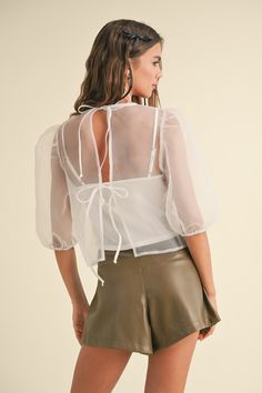 Channel your inner fashionista with our My Way Sheer Top. Made from a delicate, sheer fabric, this top adds a touch of elegance and allure to any outfit. The adjustable ties at the back ensure a perfect fit, while the lining underneath provides comfort and coverage. Shine in style with this must-have piece. WE ONLY OFFER STORE CREDIT FOR RETURNS! Feel free to email us at hello@shopmaude.com regarding sizing, fit, or our return policy. White Liner, White Liners, Get Real, Sheer Fabric, Crop Top Blouse, Denim Flares, Sheer Top, Sheer Sleeves, Sheer Blouse