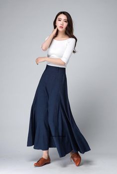 "'70s-inspired dark blue skirt from Xiaolizi. The maxi skirt in a high-rise construction with a slim-cut, the elegant skirt flowing fit all the way down to the ankle. The high waisted skirt topped with a banded waist. The A line skirt finished with pleating details. DETAIL * Soft linen cotton blend * 50% Linen , 50% Cotton * Summer maxi skirt * Side zipper in the right side * Has no pockets * Ankle length * More colors select from the picture NO. 4 https://etsy.me/3fOKWlH * The model is 168 cm ( Relaxed Maxi Skirt With Pleated Wide Hem, Fitted Maxi Skirt With Lined Wide Hem, Fitted Maxi Skirt With Wide Hem And Lining, Wide Hem Fitted Lined Skirt, Fitted Wide Hem Lined Skirt, Fitted Skirt With Lined Wide Hem, Fitted Skirt With Wide Hem And Lining, Fitted Blue A-line Maxi Skirt, Blue Relaxed A-line Maxi Skirt