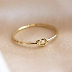 10K Solid Gold Love Knot Ring Stacking Dainty Minimalist Knuckle Band Light Weighted Simple Forget Me Knot Ring Handmade Friendship Ring This awesome ring features studded gold ring this style and charm available in thirty six sizes. The unique pattern in and geometric shape of sank make the ring so dainty and minimalist that you can wear it every day. A perfect gift for Valentine's Day anniversaries, birthdays, and graduations, this piece is so cute and sophisticated that you would like to wear Elizabeth Stone, Gold Knot Ring, Dainty Gold Ring, Friendship Ring, Love Knot Ring, Local Eclectic, Golden Design, Knot Tie, Gold Rings Simple