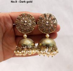 Dark Gold jhumka earrings tikka set. Earrings length: 2.8 inches (with drops) Stud diameter- 1.2 inches Dome Size: 1.1 inches Dual-tone Kundan Jhumkas For Wedding, Bollywood Style Dual-tone Chandbalis For Wedding, Dual-tone Danglers For Wedding And Navratri, Dual-tone Kundan Jhumkas For Diwali, Dual-tone Chandbali Jhumkas For Wedding, Bollywood Dual-tone Jhumkas For Diwali, Dual-tone Round Jhumkas For Diwali, Dual-tone Jhumkas For Diwali, Dual-tone Jhumkas For Wedding And Navratri