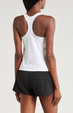 A built-in shelf-bra keeps you supported in this racerback tank top cut with signature Dri-FIT technology for cool, dry comfort as you work up a sweat. 20 1/2" length (size medium) Scoop neck Racerback Built-in shelf-bra Dri-FIT moisture-wicking technology 82% polyester, 18% spandex Machine wash, line dry Imported Athleisure T-back Top For Training, Fitted T-back Tank Top For Sports, Nike Yoga Top With Built-in Bra, Sporty T-back Tank Top With Medium Support, Sporty Tank Top With Medium Support And T-back, Breathable Fitted Racerback Tank Top, Fitted Breathable Racerback Tank Top, White T-back Top With Built-in Bra, Athleisure T-back Training Top