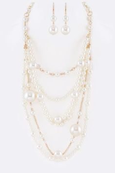 Mix Pearl Statement Layer Necklace Set Experience the elegance of layered pearls with this statement necklace set. This set includes multiple strands of pearls, creating a luxurious and classic look that will elevate any outfit. Made with high-quality materials, this necklace set is built to last and perfect for special occasions or adding a touch of sophistication to your everyday style.Necklace 1- 19" + ExtensionNecklace 2- 26"Earrings - 2.25" DropLead & Nickel Compliant White Pearl Layered Necklace With Pearl Chain, White Pearl Chain Layered Necklace, Elegant Pearl Layered Necklace With Pearl Chain, Elegant Layered Pearl Necklace, Multi-strand Layered Pearl Necklace For Party, Multi-strand Layered Pearl Chain Necklace For Parties, Party Layered Pearl Necklace With Pearl Chain, Elegant White Pearl Layered Necklace, Multi-strand Pearl Drop Necklaces For Party