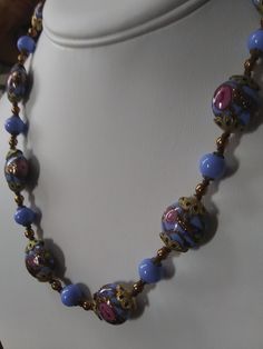 "Gorgeous, authentic Murano, vintage Venetian \"wedding cake\" glass bead handmade necklace with blue, pink, and aventurine flecked gold glass from Murano, Italy, 1970s. Beautiful blue beads of different shapes, with pink rose flowers and gold aventurine flecks threaded through the design of the large beads, alternating with smaller solid blue glass beads and gold-fill and brass spacer beads. Vintage Italian glass artistry from the 70s. A wonderful \"something blue\" for a bride, a perfect weddi Vintage Czech Glass Necklace With Polished Beads, Vintage Czech Glass Polished Beads Necklace, Vintage Czech Glass Necklaces With Polished Beads, Vintage Necklace With Polished Beads, Vintage Jewelry With Bead Caps And Round Beads, Vintage Blue Single Strand Jewelry, Vintage Czech Glass Beaded Necklace With Round Beads, Vintage Style Czech Glass Beaded Necklace, Vintage Czech Glass Beaded Necklaces With Round Beads