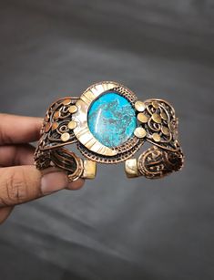 Note:- The items are pure handmade, slight variation in shape and size are to expected.Hello and Welcome To RSJEWELLERYHOUSE , where we present our best designed products. We, self are the designers, makers and sellers. We Have aimed to Supply Good Quality Products  at best prices around. For more details direct message us. Tibetan Turquoise Copper Cuff Bracelet Turquoise Bracelet Copper Wire Wrapped Cuff Adjustable Bracelet Copper Wire Jewelry Turquoise Bangle Metal-Copper Gemstone-Tibetan Turq Turquoise Bangle, Copper Wire Jewelry, Tibetan Turquoise, Copper Cuff Bracelet, Jewelry Turquoise, Copper Cuff, Bring Happiness, Copper Jewelry, Adjustable Bracelet