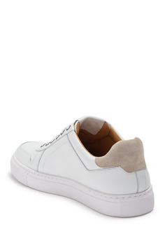 White shoes always add a fresh and clean look to an outfit. This leather sneaker is sporty yet classy with contrasting suede details and sleek silhouette.Sizing: True to size. White Platform Sneakers With Contrast Sole For Light Sports, White Leather Platform Sneakers For Casual Sports, White Platform Sneakers For Light Sports With Textured Sole, White Sneakers With Stitched Sole And Round Toe, Custom Sneakers With Contrast Sole For Light Sports, Casual White Sneakers With Stitched Sole, Modern White Custom Sneakers Plain Toe, Modern White Custom Sneakers With Plain Toe, Custom Sneakers With Rubber Sole