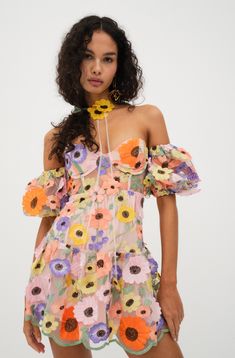 Beauty is in bloom with our Prato Mini Dress by For Love & Lemons. Details Wildflower embroidered fabric Strapless mini dress with underwire cups and empire waist seam. Dropwaist skirt with contoured tier. Low back neckline with scalloped edge and strap across back. Partially lined. Fabric + Care Self: 100% Polyester; Lining: 98% Recycled Polyester/ 2% Spandex Eco Dry Clean recommended. Avoid cleaners that use harmful chemicals like "Perc". Spring Coquette Mini Dress, Spring Off-shoulder Corset Dress For Cocktail, Off-shoulder Corset Dress For Spring Cocktail, Floral Print Mini Corset Dress For Party, Summer Strapless Mini Dress With Lined Bodice, Coquette Short Sleeve Spring Dresses, Coquette Short Sleeve Dresses For Spring, Short Sleeve Coquette Dresses For Spring, Strapless Mini Dress With Lined Bodice For Summer