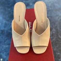 Salvatore Ferragamo Sansu Leather Mules Size 6.5 $795. Condition Is "Pre-Owned". Worn Once. Box Included. Shipped With Usps Priority Mail. Rich Leather Mules Are Set Atop An Architectural Curved Block Heel. Leather Upper Open Toe Slip-On Style Lining: Leather Leather Sole Made In Italy Size Self-Covered Block Heel, 3.25" (85mm) Please Note: Fits True To Size. Leather Slip-on Heels With Sculpted Heel, White Calf Leather Mules, Classic Leather Mules With Sculpted Heel, Designer Calf Leather Mules With Sculpted Heel, Luxury Beige Leather Heels, Leather Mules With Sculpted Heel, Almond Toe, Chic Leather Mules With Almond Toe, Chic Leather Almond Toe Mules, Beige Calf Leather Heels With Padded Heel