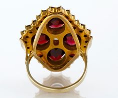 "Garnets come in many colors, but the most widely known is the rich dark red. This antique treasure of a ring features both round and oval garnets, prong and bezel set in 14 k yellow gold. Quite the statement ring, and you certainly don't need to be a January baby to love it! Antique Ring - Antique 14k Yellow Gold Garnet Statement Ring 14k Yellow Gold Garnet Ring Size 7 Ring measures approximately 1-1/8\" from top to bottom. back of band is 1.9mm wide. Please read our shop policies prior to purc Yellow Gold Garnet Ring With Rose Cut Diamonds, Antique Yellow Gold Multi-stone Ruby Ring, Antique Ruby Ring With Multi-stone, Antique Multi-stone Ruby Ring In Yellow Gold, Victorian Oval Ruby Ring In Yellow Gold, Oval Multi-stone Garnet Rings, Yellow Gold Garnet Multi-stone Ring, Multi-stone Garnet Ring In Yellow Gold, Victorian Oval Ruby Ring With Prong Setting