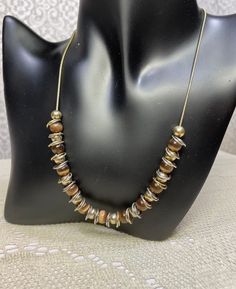 Beautiful vintage gold chain necklace with brown swirl glass beads. The loops in between the beads are gold and silver. Excellent condition!Extends up to 20" long. Brown Necklaces, Vintage Gold Chain, Vintage Chain Necklace, Vintage Gold Necklace, Necklaces Vintage, Vintage Chain, Brown Necklace, Fossil Coral, Bib Necklaces