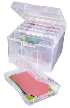 a plastic storage box filled with lots of crafting supplies