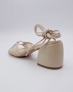 Chunky heel with knotted lace-up design. Meet Celia, the spring/summer season's sultry character. She's here to give your wardrobe the flirty, romantic feel it's been missing. For something special, lace up these beige strappy heels to be the style staple that defines your season. 2.5" heel 30.75" lace Man-made materials. Black Bird, Summer Season, Strappy Heels, Chunky Heel, Something Special, Chunky Heels, Lace Up, Spring Summer, Wardrobe