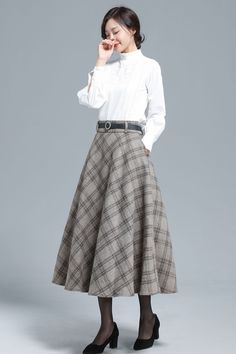 Khaki Plaid Wool Skirt 3133 – XiaoLizi Beige A-line Pleated Skirt For Fall, Classic A-line Pleated Skirt For Fall, Flowy A-line Skirt For Fall, Fitted Long Pleated Skirt For Fall, Winter Workwear Skirt With Pockets, Relaxed Skirt With Pockets For Fall, Full Skirt For Workwear In Fall, Fall Long Pleated Skirt, Winter Full Skirt Bottoms With Pockets