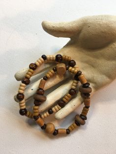 SALE! Get out your bellbottoms and and floppy hat, this 2 piece stretch bracelet set features warm brown and tan wooden beads. 7 1/2" to 8". A lovely gift or treat yourself! Comes with gift box. Brown Wooden Beaded Bracelets As A Gift, Brown Wooden Beaded Bracelet As A Gift, Brown Wooden Beads Bracelets Gift, Brown Wooden Bracelets With Round Beads, Spiritual Brown Beaded Bracelets With Wooden Beads, Spiritual Brown Wooden Beaded Bracelets, Brown Wood Beaded Bracelets, Brown Beaded Wood Bracelets, Brown Rustic Beaded Bracelets With Round Beads