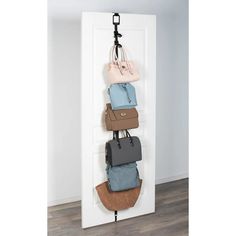 a white door with several purses hanging on it