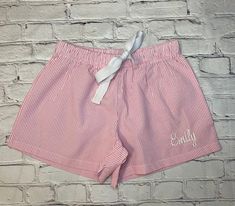 Perfect, preppy and stylish....Our women's seersucker lounge shorts are great for relaxing in style at the beach, by the pool, at the lake, and around the house. Women of all ages wear them for a stylish comfy look to run those quick errands. Ideal for bridesmaid gifts or a pair for each of the women on the family vacation! Trimmed in White Piping Coordinating V-necks available Machine Wash (designed to get softer with each wash --- you'll adore it!) 35% Polyester/65% Cotton (specially blended c Summer Vacation Sleepwear With Built-in Shorts, Relaxed Fit Shorts For Summer Pajama Party, Striped Pajama Shorts For Summer Pajama Party, Striped Sleepwear For Summer Sleepover, Summer Sleepover Shorts With Elastic Waistband, Cotton Shorts For Sleepover In Spring, Summer Pajama Shorts For Sleepovers In Spring, Summer Shorts For Pajama Party, Pink Shorts For Summer Pajama Party