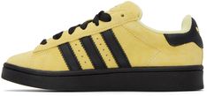 Low-top suede sneakers in yellow. Perforated detailing and leather signature serrated stripes in black at sides. · Lace-up closure · Logo embossed at padded tongue · Padded collar · Logo embossed at heel tab · Terrycloth lining · Treaded rubber sole in black Supplier color: Almost yellow/Core black Yellow Leather Skate Shoes With Laces, Yellow Suede Sneakers For Streetwear, Yellow Low-top Sneakers With Adidas Logo, Yellow Adidas High-top Sneakers, Yellow Adidas Lace-up Sneakers, Yellow Leather Adidas Sneakers, Adidas Yellow Breathable Sneakers, Yellow Core, Original Clothes