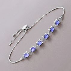 Tanzanite Bracelet, Real Tanzanite Oval Bolo Bracelet in .925 Sterling Silver, December Birthstone, Anniversary Gift, Bridesmaid Gift This 1.98-carat genuine tanzanite bolo bracelet showcases the enchanting allure of tanzanite in a sleek .925 sterling silver setting. The vibrant stones are arranged along a delicate chain, allowing their stunning color to take center stage. The bolo design offers both comfort and style, making this bracelet a versatile accessory that adds a sophisticated touch to Adjustable Oval Fine Jewelry Bracelet, Silver Birthstone Bracelets For Formal Occasions, Silver Birthstone Bracelets, Silver Birthstone Bracelet For Formal Occasions, Formal Silver Bracelet With Birthstone, Formal Silver Birthstone Bracelets, Formal Adjustable Oval Bracelet, Adjustable Oval Sterling Silver Bracelet For Anniversary, Oval Sterling Silver Bracelet In Fine Jewelry Style