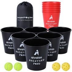 six black cups with yellow balls in front of them and a red bag on the side