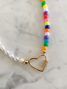 "Pair with a few beaded necklaces and your look is complete🤩 Check out insta for some fun ways to style it Length available in 18\" or 20\" and each has a 2\" extender" Trendy Gold Beaded Necklaces With Heart Beads, Trendy Gold Beaded Necklace With Heart Beads, Trendy Rainbow Necklace With Heart Beads, Trendy Rainbow Necklaces With Heart Beads, Trendy Heart-shaped Multicolor Beaded Necklace, Trendy Multicolor Heart-shaped Beaded Necklace, Trendy Multicolor Heart Beaded Necklace, Trendy Heart-shaped Adjustable Beaded Necklace, Trendy Adjustable Heart-shaped Beaded Necklaces