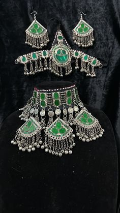 Exquisite Afghan Jewelry Set - Perfect for Special Occasions🇦🇫 Add a touch of exotic elegance to your look with our stunning Afghan jewelry set. Handcrafted by skilled artisans, each piece is a unique work of art that captures the rich cultural heritage of Afghanistan. This set includes a dazzling necklace, matching earrings, and a Tikka headpiece, all intricately designed with traditional Afghan motifs and embellished with vibrant gemstones. Bohemian Hand Set Jewelry For Festive Season, Bohemian Hand Set Jewelry For Festive Occasions, Hand Set Bohemian Jewelry For Festive Season, Unique Green Jewelry For Festivals, Unique Green Festive Jewelry, Unique Festive Green Jewelry, Bohemian Beaded Chandbali Jewelry, Bohemian Chandbali Beaded Jewelry, Traditional Jewelry For Festivals