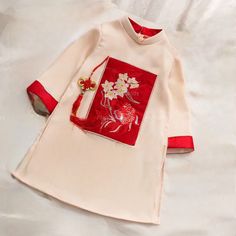 This beautiful modern ao dai set is perfect for any special occasion: Lunar New Year, Mid Autumn Festival, Attending a Wedding, or a Family photoshoot. 🌿 This set includes an Ao Dai top and No pants. Style: Traditional Material: Very well made with high-quality silk suitable for skin kid Collar: 1.5 cm Please provide bust-waist-and hip measurements when placing your order to ensure the best fit for you. 🌿 NOTE: * Recommend gentle washing * Please contact us for any inquiries about size. We don Traditional White Cheongsam For Spring, Ceremonial Long Sleeve Ao Dai, Spring Ceremony Long Sleeve Ao Dai, Long Sleeve Floral Embroidery Dress For Ceremony, Long Sleeve Dresses With Floral Embroidery For Ceremony, Spring Ceremony Ao Dai With Long Sleeves, Formal Embroidered Ao Dai For Spring, Embroidered Ao Dai For Spring Formal, Festive Long Sleeve Ao Dai For Ceremony