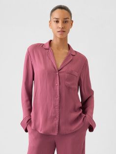 Soft satin pajama shirt.  Notch collar, button front.  Long sleeves.  Patch pocket at chest.  Certain styles have allover prints.  Fit: Over Collared Shirt For Loungewear In Fall, Collared Shirt For Fall Loungewear, Casual Collared Top For Pajama Party, Gap Summer Tops With Spread Collar, Pink Button-up Shirt For Loungewear, Gap Collared Shirt For Daytime, Gap Collared Shirt For Daywear, Spring Loungewear Shirt With Spread Collar, Gap Relaxed Fit Sleepwear For Pajama Party