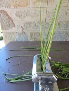 a knife and some grass on a table