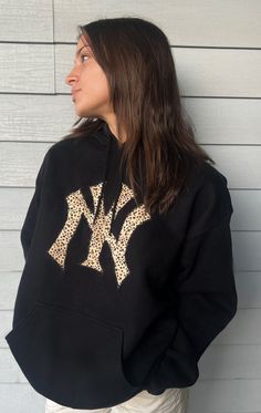 Super comfy black hoodie with NY Yankee Logo! (Can also do other teams & colors DM and ask!) Black Fan Apparel Hoodie For Game Day, Black Game Day Fan Apparel Hoodie, Black Fleece Hoodie For Game Day, Black Collegiate Hoodie For Game Day, Black Hoodie With Drawstring Hood For Game Day, Black Sporty Hoodie For Game Day, Black Hoodie With Letter Print For Game Day, Black Fleece Hoodie With Letter Print, Black Varsity Hoodie