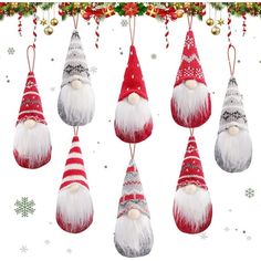 an assortment of christmas ornaments hanging from a line with snowflakes in the background