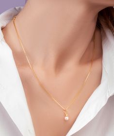 This freshwater pearl gold necklace is the epitome of timeless elegance. The necklace features a delicate chain made of high-quality gold, expertly crafted to provide durability and longevity. The centerpiece of the necklace is a stunning freshwater pearl, which shimmers with every movement. The freshwater pearl is carefully selected for its luster and beauty, making each necklace unique. The pearl is expertly set in high-quality gold, ensuring that it remains secure and safe. The delicate chain Gold Akoya Pearl Necklace, Elegant Gold Chain Necklace With Pearl Drop, Elegant Gold Pearl Necklace With Charm, Gold Pearl Necklace With Pearl Pendant, Gold-plated Chain Necklace With Pearl Drop, Gold Pearl Charm Necklace With Pearl Drop, Gold Pearl Drop Charm Necklace, Gold Plated Pearl Necklace With Clavicle Chain Pendant, Delicate Gold Pearl Chain Necklace