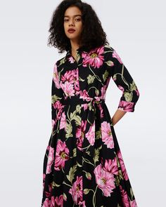 Crafted from a cotton poplin, the Blaine midi dress has a soft and structured feel. This shirt dress has a classic collar, buttons up the front, and three-quarter, cuffed sleeves. Its waist in cinched with a matching tie above a full, A-line skirt. Eloisa is 5 Foot and 8 Inches and wearing a size XS. Spring Floral Print Dress With Collared Neckline, Cotton Midi Dress With Floral Print For Work, Collared Midi Dress With Placket, Mid-length Shirt Dress For Daywear, Spring Cotton Collared Midi Dress, Spring Collared Dresses With Placket, Formal Collared Floral Print Dress, Formal Collared Dress With Floral Print, Feminine Shirt Dress With Buttons For Work