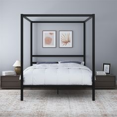 a bed that is in a room with gray walls