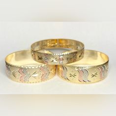 Set Of 3 18k Gold Fill Bangle Bracelets. Engraved With Various Designs In Gold, Rose And Grey. In Excellent Like New Condition. The Two Larger Bracelets Are 8-1/2" Around And 1" Wide. The Smaller Bracelet Is 8-3/4" Around And 5/8" Wide. Please Contact Me If You Have Any Questions. Yellow Gold Filigree Round Bangle, Ornate Gold Filigree Bangle Bracelet, Yellow Gold Filigree Bangle Bracelets, Bangle Bracelets Gold, Ornate Gold Hand-set Bracelets, Yellow Gold Filigree Bracelets, Gold Plated, Engraved Bangle Bracelet, Engraved Bangle, Large Bracelet