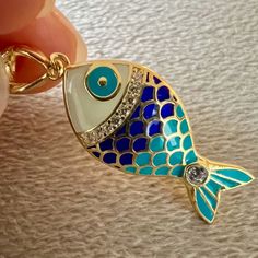 "Great workmanship, bright colors, quality material.  Pendant is covered with shiny enamels. Made with 925 sterling silver. Fish pendant does not cause allergies and does not contain nickel. Fish necklace is gold-color because it is plated on silver. A sparkling gift option for your ocean-lover friends on Christmas. If you love fish, you can take a look here for different options. https://www.etsy.com/shop/NNGJewellery?section_id=46434843 Material : 925 ct silver, enamel Weight : 2.8 gr Fish Size :  22 mm x 12 mm. Colors : Gold Gemstone : Zircon. Chain colors : Gold Chain size:  16\" + 2 '' (40cm + 5 cm) , 18'' + 2'' (45 cm + 5 cm) They will come with a gift box. All orders will be shipped out within 1-2 business days after the order has been received. Shipping : Standard Shipping usually Blue Enamel Necklaces With Lobster Clasp, Enamel Fish-shaped Jewelry For Gifts, Enamel Fish-shaped Jewelry As Gift, Fish-shaped Enamel Jewelry For Gifts, Fish-shaped Enamel Jewelry As A Gift, Fish-shaped Enamel Jewelry Gift, Christmas Gift Mom, Gift For Bff, Sparkle Gift