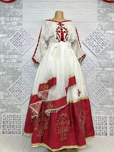 Beautiful Ethiopian and Eritrean Habeshan Dress. Stylish Menen, 100% Cotton We recommend hand washing and air drying to make it last longer. A low heating iron will also keep design and look. Beautiful Habeshan Dress |Ethiopian Traditional Dress|Eritrean Dress|Habesha Kemis|Zuria|Habesha Chiffon|Kemis Traditional Red Dresses For Eid, Red Traditional Dress For Eid, Festive Tunic Dress With Traditional Patterns, Traditional Organza Dress With Pallu, Festive Dress With Traditional Patterns, Festive Dress With Traditional Patterns For Celebration, Traditional Red Dress With Traditional Drape, White Floor-length Dress For Celebration, Traditional Red Tunic Dress