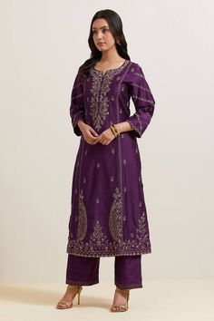 Purple natural weaves chanderi silk kurta with contrast paisley and floral embroidery. Comes with pant and shimmer organza dupatta.
Components: 3
Pattern: Embroidered
Type Of Work: Floral and Paisley
Neckline: Notched
Sleeve Type: Three Quarter
Fabric: Chanderi Silk, Shimmer Organza
Color: Purple
Other Details: 
Embroidered hem pant
Fringed border dupatta
Occasion: Puja - Aza Fashions Embroidered Hem, Natural Weave, Silk Kurta, How To Hem Pants, Organza Dupatta, Kurta Set, Pant Set, Womens Tunics, Embroidered Silk