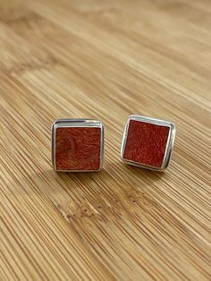 Red Coral and Sterling Silver Square Bezel Set Stud Earrings with Push Back Style:=Push Back 0.50 Inches Wide Finish: Polished Includes: Gift Pouch NOTE: Coral is genuine, but has been enhanced/treated for color and finish. This is very common in coral jewelry set in silver pieces. Shipping: Item will ship within 2 Business days, this does not include time in transit. This item will ship fully insured with USPS Returns:I gladly accept returns and exchanges Contact me within: 7 days of delivery S Red Polished Earrings For Gift, Coral Jewelry Set, Coral Jewelry, Bespoke Jewellery, Gift Pouch, Precious Gems, Silver Pieces, Red Coral, Bezel Setting