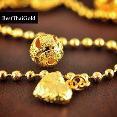 This Shop has a Special Free Gift (Chain) for Every Order. 😊🙏 Item: 1 x Bracelet For: Women Type: GOLD PLATED over Brass, Nickel free Gold Purity: 96.5% Surface: Sand matted Charm: Heart & Bell Length: ~ 6.5-7 inches Weight : ~ 7 grams Color: Yellow Gold (slightly +/- from photo) Handmade from Thailand. Thai gold plating technic really solid and stunning look. Rewarding your life from hard working, match up your dress, bridesmaid wedding engagement or a gift to someone special for you. The Gold Plated Chain Bracelet With Gold Beads For Gift, Gold Charm Bracelet With Adjustable Chain And Round Beads, Gold Plated Gold Beads Bracelet Gift, Gift Gold Plated Bracelet With Gold Beads, Gold Plated Bracelet With Gold Beads For Gift, Gold-plated Bracelet With Beads As Gift, Gold Charm Bracelet With Round Beads For Party, Gold Bracelets With Round Beads For Celebration, Gold Charm Bracelet With Round Beads For Gifts