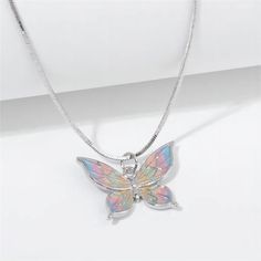 Description:Enamel Butterfly NecklaceSpecifications:Material: copper, enamel, silverColors: SilverSize: 40 cm + 5 cm extWeight: 6 g/pc Upgrade your style with our Enamel Butterfly Necklace. With a charming design and playful colors, this necklace will add a touch of whimsy to any outfit. Stand out with this unique accessory and make a statement without saying a word! Butterfly Chain Necklace, Butterfly Chain, Playful Colors, Enamel Butterfly, Handmade Butterfly, Color Butterfly, Delicate Butterfly, Butterfly Pendant Necklace, Pink Enamel