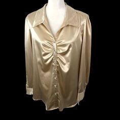 In A World Where Elegance Meets Comfort, This Unique Spectrum Satin Blouse Stands Out. Its Ruched Front And Glistening Buttons Add A Touch Of Glamour, While The Stretch Fabric Ensures A Perfect Fit. Crafted For Those Who Cherish Unique Style And Sophistication. Size Xl Stretch Fabric Button-Up Front Ruched Detailing Satin Material Long Sleeves With Cuffs Collared Neckline Machine Washable Faux Diamond Buttons Small Tear Under The Arm. Top To Bottom = 27 Inches Armpit To Armpit = 21 Inches This L Cheap Party Blouse With Buttons, Luxury Padded Button-up Blouse, Affordable Fitted Blouse Piece For Celebration, Cheap Gold Blouse With Buttons, Affordable Gold Button-up Blouse, Unique Tops, Satin Blouse, Satin Material, Office Wear