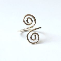 "This silver spiral ring is handmade with solid Sterling Silver. A classic and timeless design that looks fabulous with everything, and is comfortable to wear every day. Please select your size when ordering. Sizes are listed in UK/Australia format, but you can give your measurement in millimetres or in international sizes, whatever is easiest for you. Select \"Other Size\" from the bottom of the list, then add a note in the \"message to seller\" box at checkout. ❀ Made with 935 Sterling Silver, Adjustable Spiral Midi Rings In Silver, Adjustable Spiral Silver Midi Rings, Adjustable Silver Spiral Midi Rings, Hand Forged Silver Spiral Rings, Handmade Sterling Silver Spiral Rings, Silver Spiral Wire Wrapped Rings, Nickel-free Silver Spiral Rings, Nickel-free Spiral Silver Rings, Handmade Sterling Silver Swirl Rings